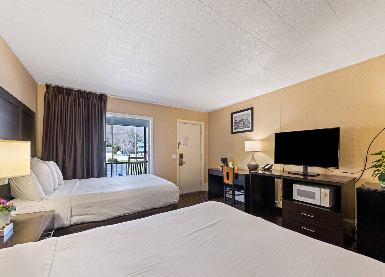 Classic two-queen room with two beds at Castlewood Inn, Maggie Valley